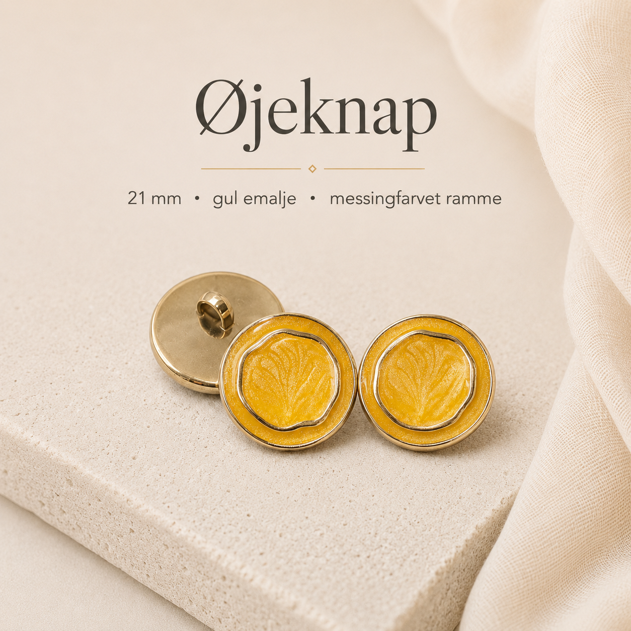 21 mm. øjeknap m. gul emalje - messingfarvet