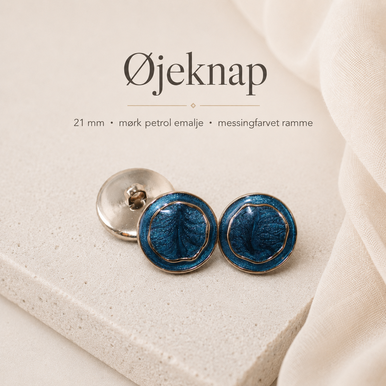 21 mm. øjeknap med mørk petrol emalje