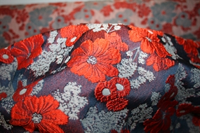 Jacquard med orange blomster