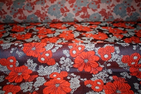 Jacquard med orange blomster